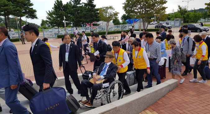 Two Koreas begin first family reunions in almost three years