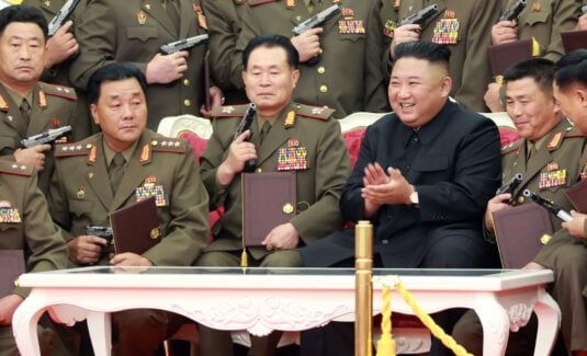 Kim Jong Un gifts guns to army officers as North Korea marks war ...